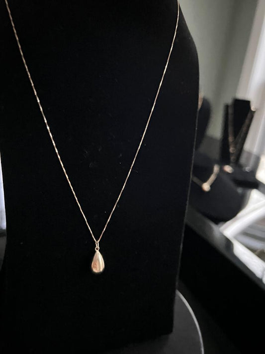 14K yellow gold necklace with 14K drop shaped pendant = Simple Elegance that Radiates
